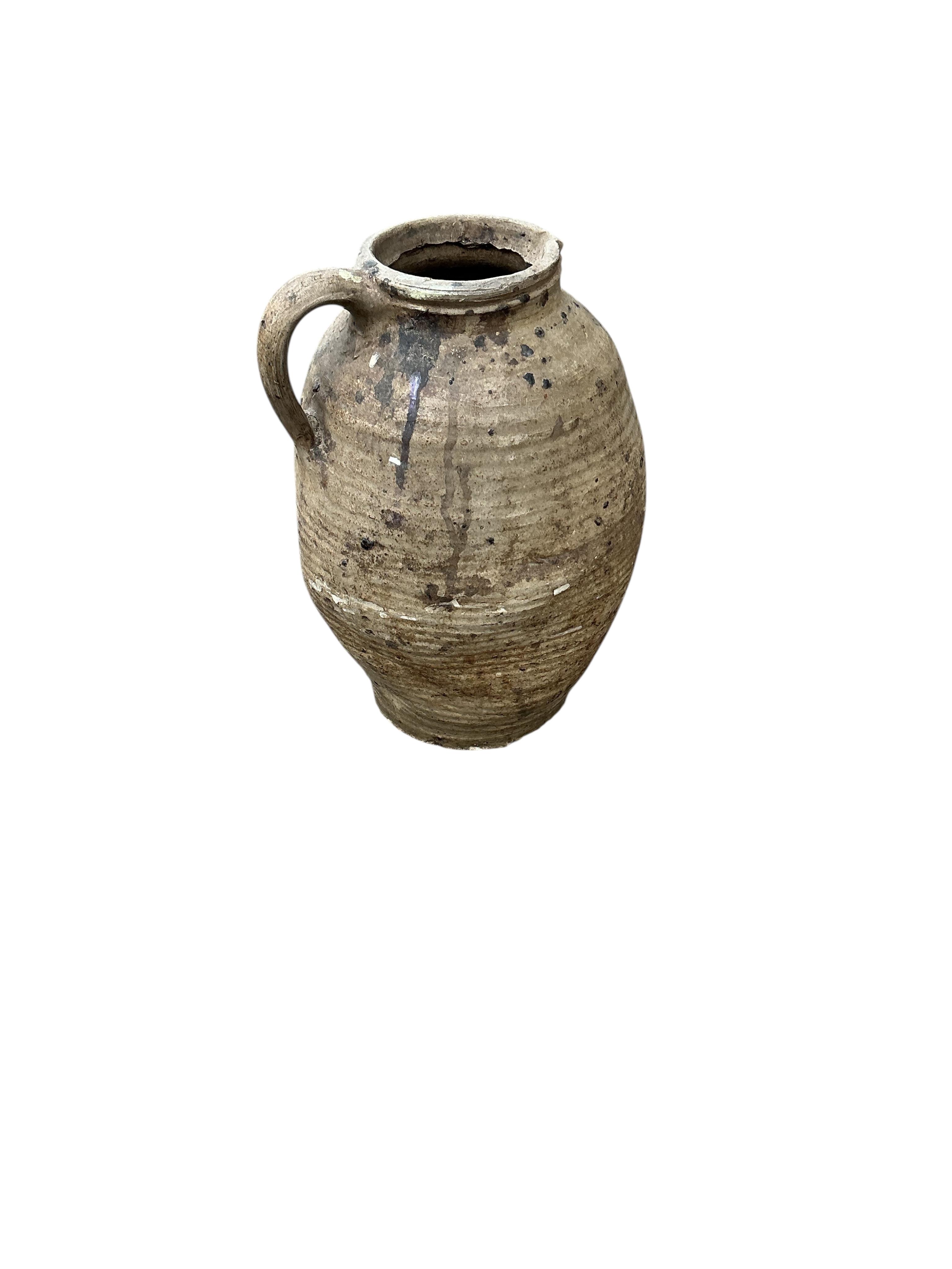 Nine earthenware containers, largest height 41cm
